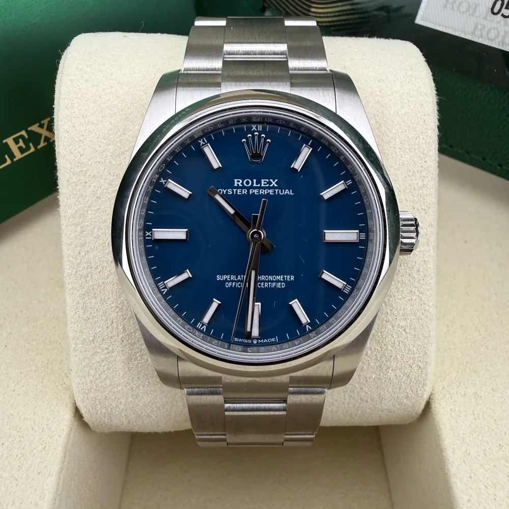 Rolex Oyster Perpetual 34 124200, Mediterranean blue dial, front view in its box